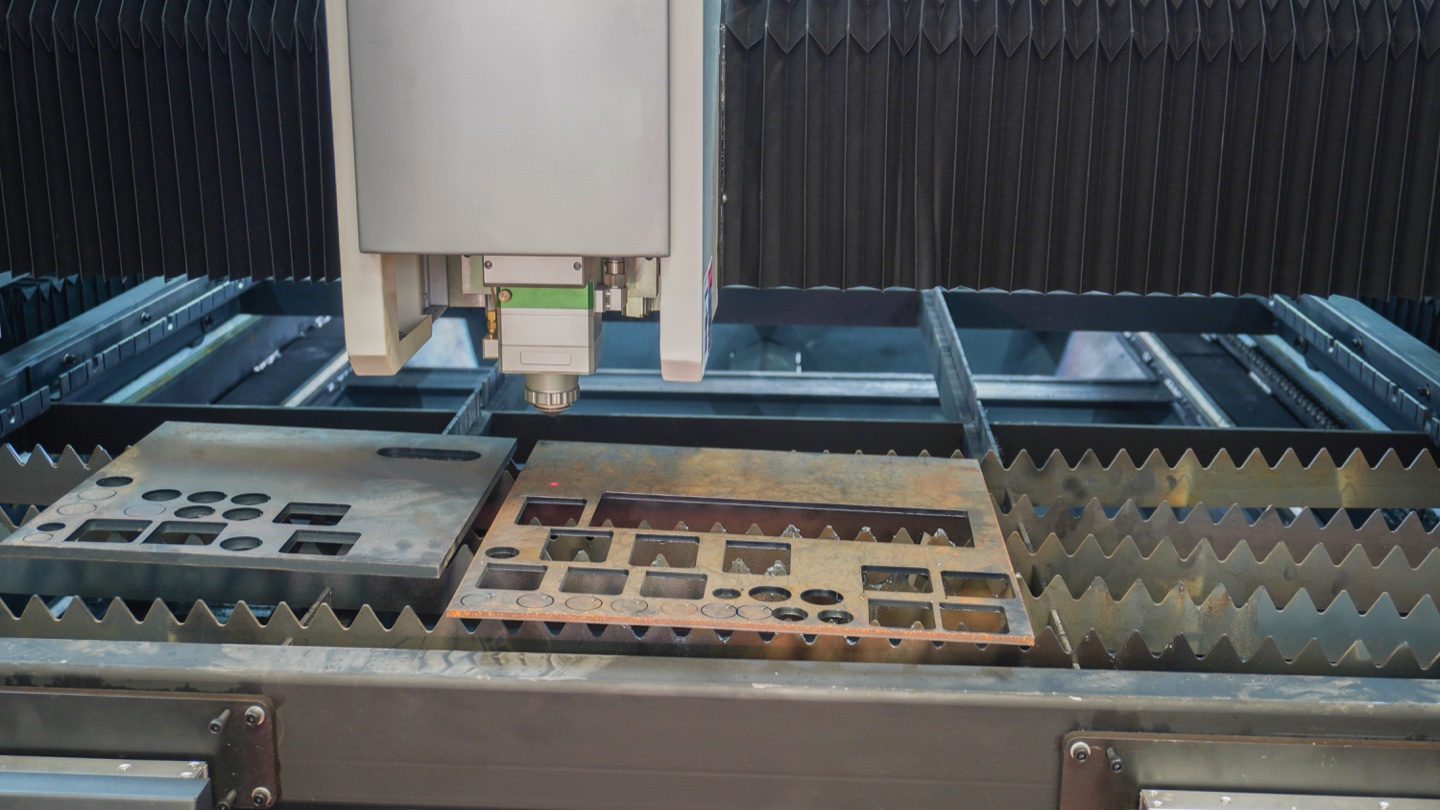 Several sample profiles cut from sheet illustrate how part layout and material utilization affect cost per part.