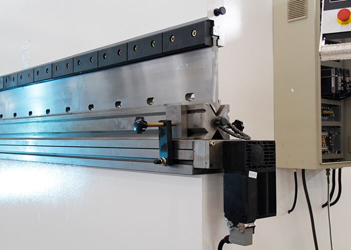 Press brake crowning system installed on CNC press brake machine
