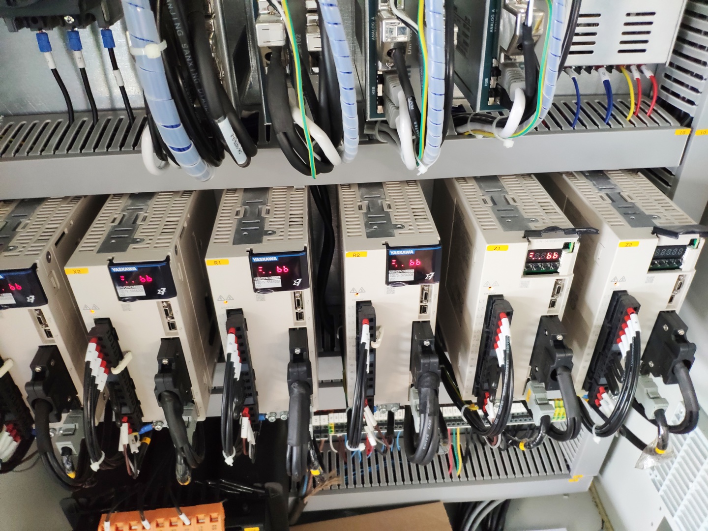 Axis servo drives inside a CNC press brake electrical cabinet.
