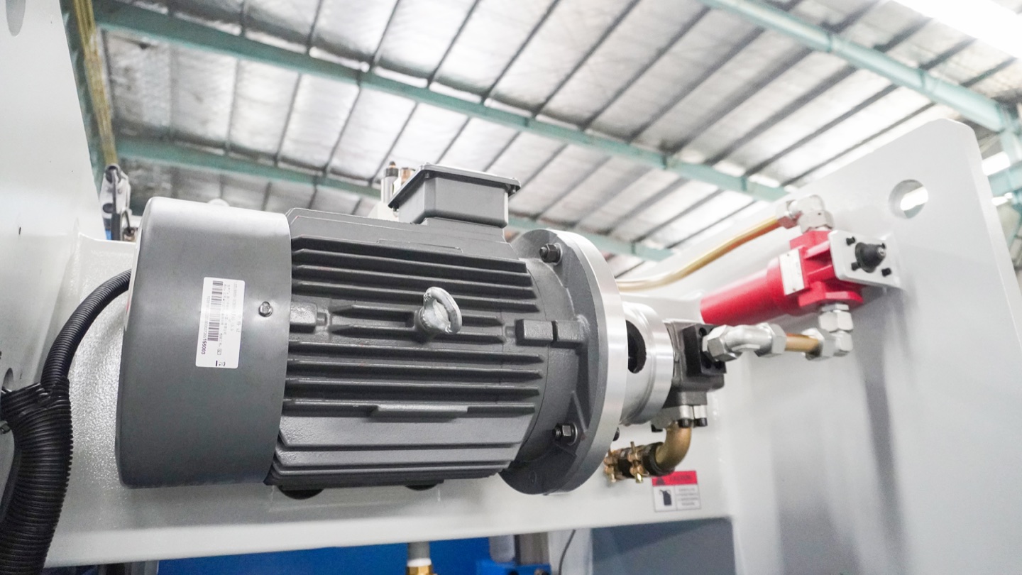 Hydraulic motor, pump and connected lines, accessible items for routine press brake inspection.