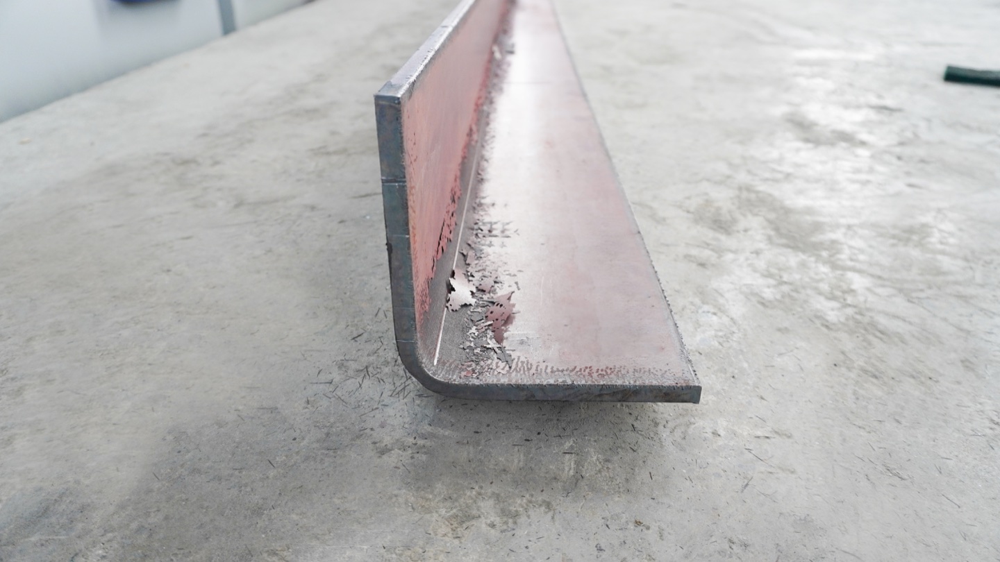 A thick bent plate illustrates why material strength, thickness and inside radius must be checked together.