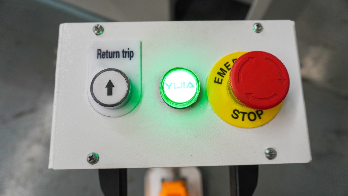 Emergency stop button on a press brake control pedestal