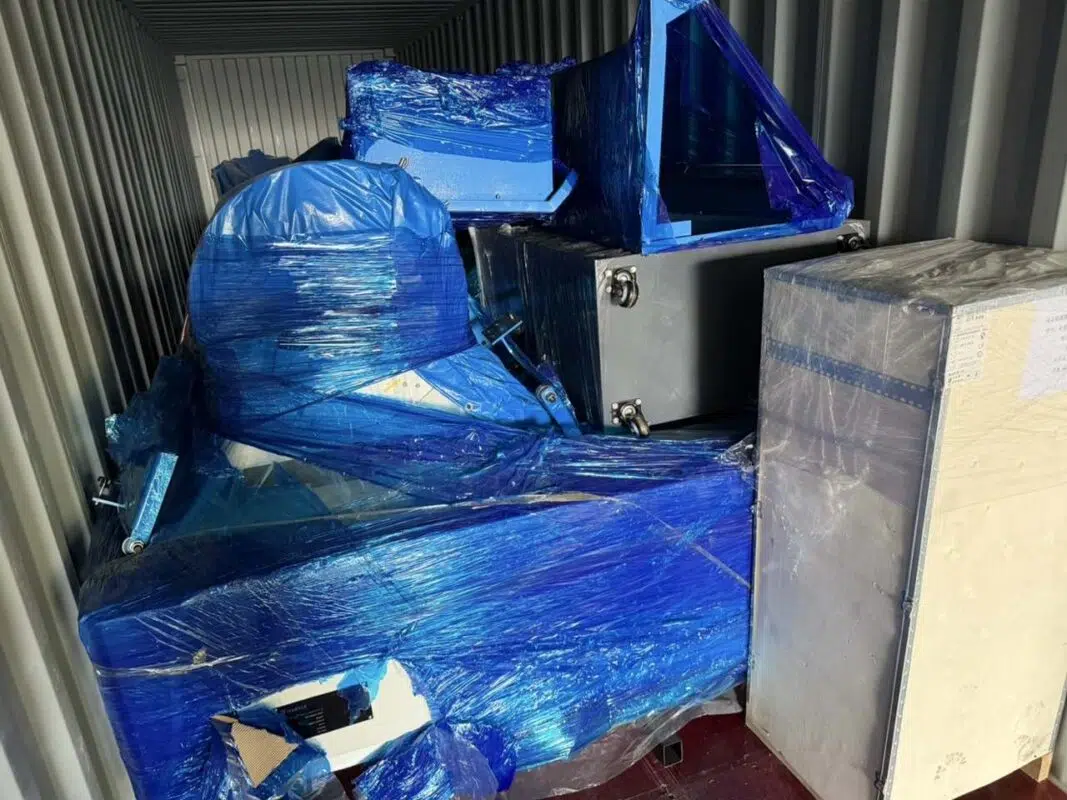 Separately wrapped equipment components inside the shipping container.